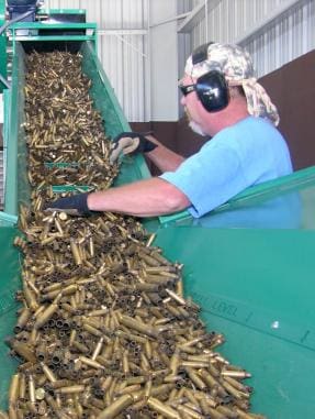 Tom Fujan recycles expended Air Force small arms brass shells on Nov. 5, 2007. The machine renders the shells unusable and ready for sale.